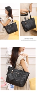 Detail view of black chevron quilted tote bag and matching mini coin purse set