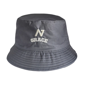Close-up of dark grey reversible bucket hat featuring white letter embroidery detail