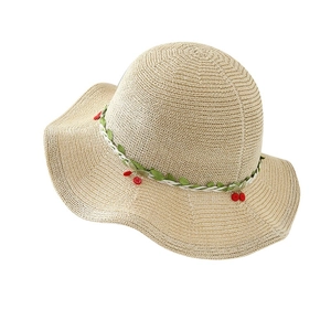 Straw sun hat with green vine and red cherry accents for summer beach sun protection