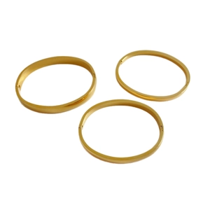 Three-piece set of minimalist polished gold stainless steel oval bangles with clasp