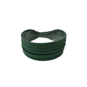 Detailed close-up of dark green layered pleats on elastic wide sports yoga headband