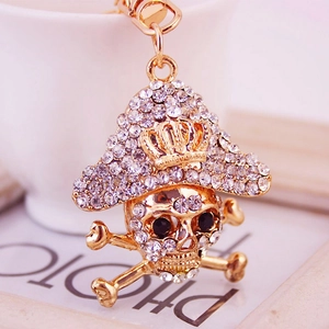 Creative pirate skull keychain with crystal rhinestones on a gold metal pendant