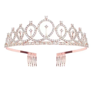 Elegant rose gold birthday crown with clear rhinestones and hair combs on white background