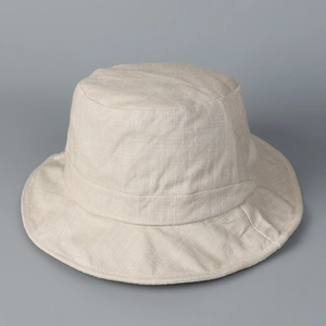 Detail of breathable linen sun hat showing natural fabric texture and reinforced seams