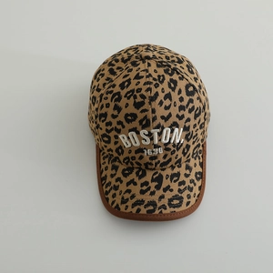 Detailed view of leopard print baseball cap with white Boston 3D embroidery and brown piping