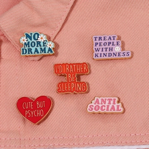 Enamel alloy brooch set with No More Drama slogans on pink denim background