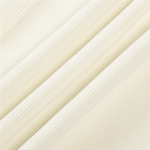 Close-up of off-white ribbed knit wide-leg joggers showing soft textured fabric details