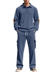 Detail of blue corduroy men's polo set featuring brown elbow patches and drawstring pants