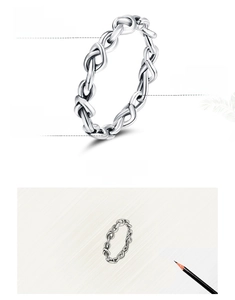 Macro detail of intertwined S925 sterling silver rope knot ring with oxidized finish