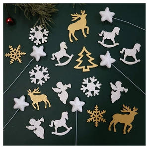 Detailed view of golden reindeer and white star ornaments for Christmas tree bouquets