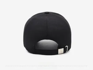 Detail view of the black cotton baseball cap back with adjustable metal buckle strap