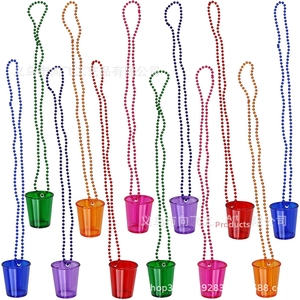 Close-up of colorful Bride to Be party cups with matching beaded plastic necklaces
