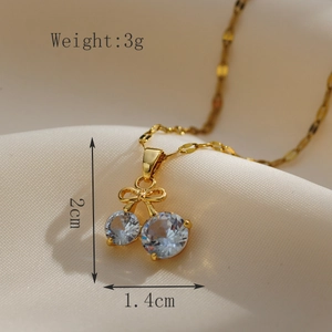 Macro shot of gold cherry pendant necklace on satin with 2cm size specifications