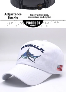 Detail of adjustable metal buckle and shark embroidery on a washed cotton baseball cap
