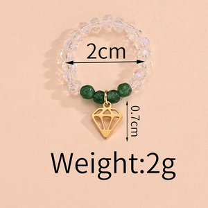 Detailed dimensions of beaded ring with gold diamond pendant and green bead accents