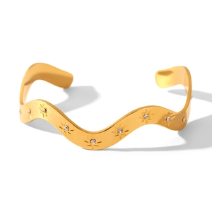 W-shaped gold plated stainless steel open bangle with star engraving and cubic zirconia