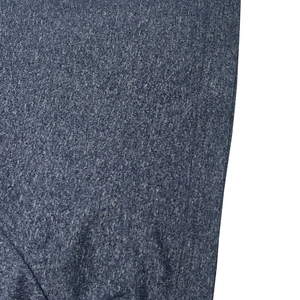 Macro shot of breathable quick-dry blue-grey heather fabric texture and fine knit detail