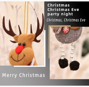 Detailed view of plush reindeer Christmas ornament with sequin accents and grey fabric