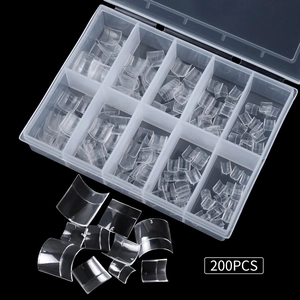 Macro view of 200pcs transparent short French nail tips in a 10-grid storage box
