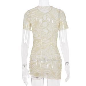 Back view of yellow and cream hollow knit mini dress with wavy texture and mesh detail