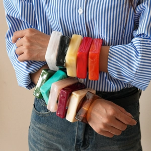 Exaggerated geometric acrylic resin bangles in multiple vibrant marbled colors for women