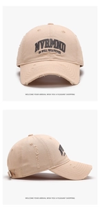 Close-up of distressed brim and embroidered letters on retro washed cotton baseball cap
