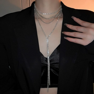 Macro view of layered silver rhinestone choker necklace with elegant Y-shape tassels