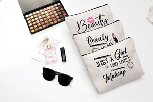 Detailed view of canvas makeup bags with beauty prints and zipper closure set