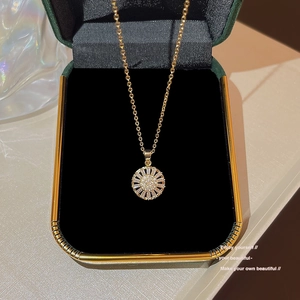 Luxurious gold sunflower pendant necklace with sparkling crystals in a green velvet box