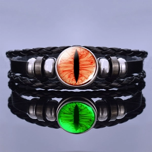 Glow-in-the-dark steampunk dragon eye leather bracelet showing green luminous effect