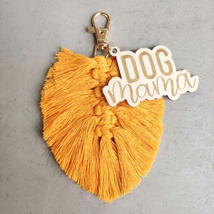 Handmade yellow woven feather keychain with wood Dog Mama tag and gold lobster clasp