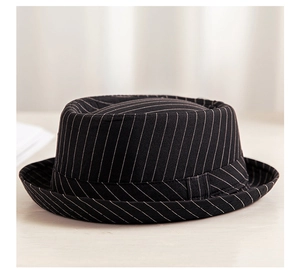 Close-up of the black and white pinstripe pattern on a breathable jazz fedora hat