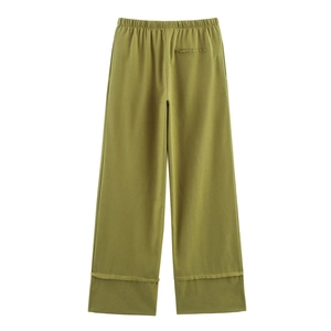 Olive green linen wide-leg trousers featuring an elastic waistband and rolled hem detail