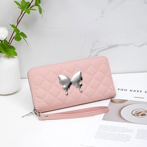 Pink quilted wallet with silver butterfly ornament and wrist strap for stylish women
