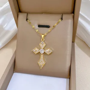 Luxurious gold cross necklace with shimmering zircon pavé presented in a gift box