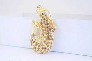 Macro shot of detailed turtle keychain with coffee rhinestones and gold plating