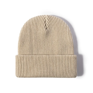 Minimalist beige ribbed knit beanie for men and women showing a warm, elastic texture
