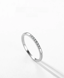 Macro shot of minimalist S925 sterling silver ring with micro-pave cubic zirconia inlay