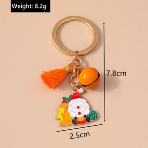 Detailed view of Christmas keychain with Santa charm, orange bell, and tassel measurements