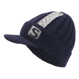Detail of navy ribbed knit beanie with brim and gray knitted S logo on the side