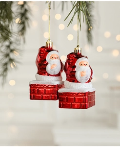 Detail of Santa Claus on chimney Christmas tree ornaments with red glitter finish