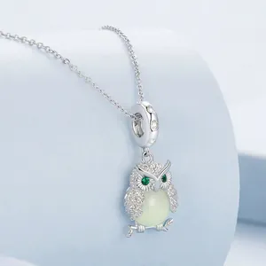 Exquisite 925 sterling silver owl pendant with luminous stone and green gem eyes