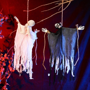 Ghostly Halloween hanging skeletons with tattered gauze on tree branches with spooky lighting
