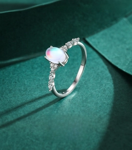 Macro shot of S925 silver ring featuring an oval moonstone with shimmering opal effect