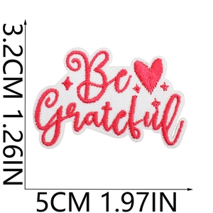 Detail shot of 'Be Grateful' embroidered patch showing precise dimensions and 5cm width