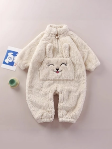 Winter plush baby romper with a cute cartoon rabbit design in creamy white fleece