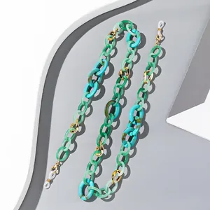 Colorful acrylic eyeglass chain with green and blue resin links and gold metal lobster clasps