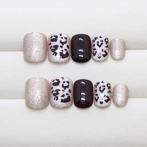Short square leopard print press-on nails with silver glitter and gloss black finish