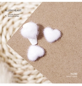 Macro shot of 18mm plush white heart ornament for nail art and DIY jewelry crafts