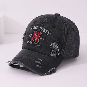 Close-up of distressed black denim baseball cap with premium letter H embroidery